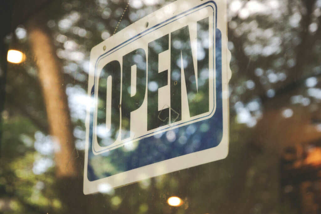 open sign on window - digital marketing for startups
