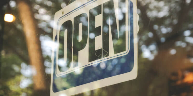 open sign on window - digital marketing for startups